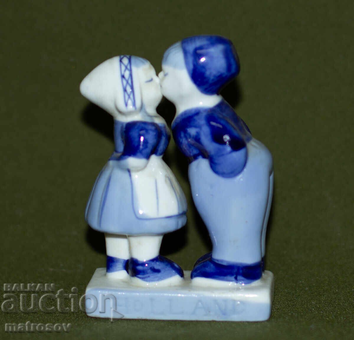 Old porcelain figurine of a boy and a girl Old porcelain figurine of a boy and a girl