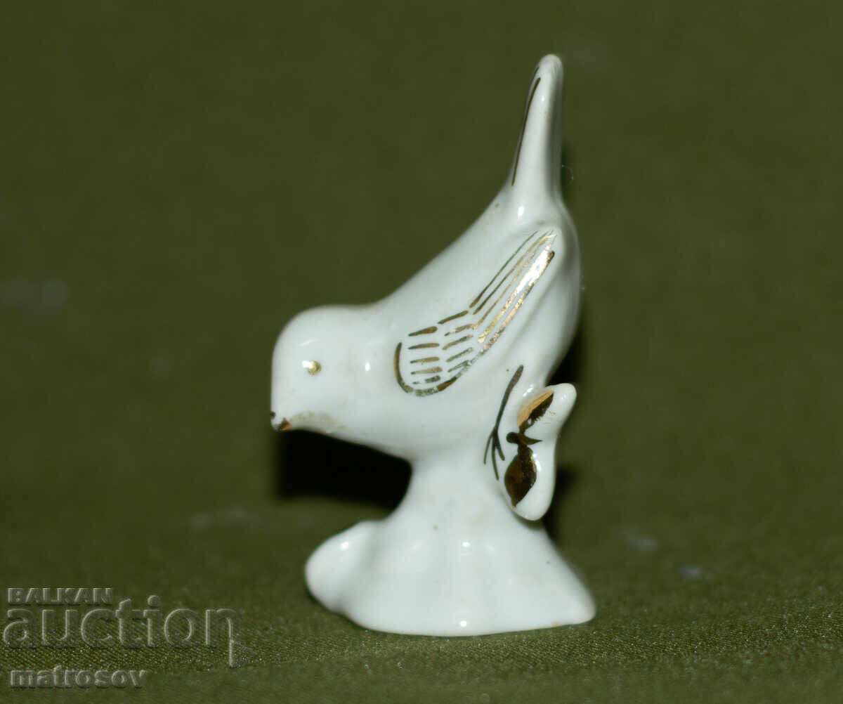 Old decorative porcelain bird figurine