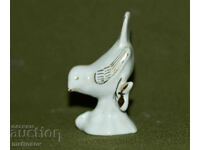 Veche statuetă decorativă din porțelan, reprezentând o pasăre