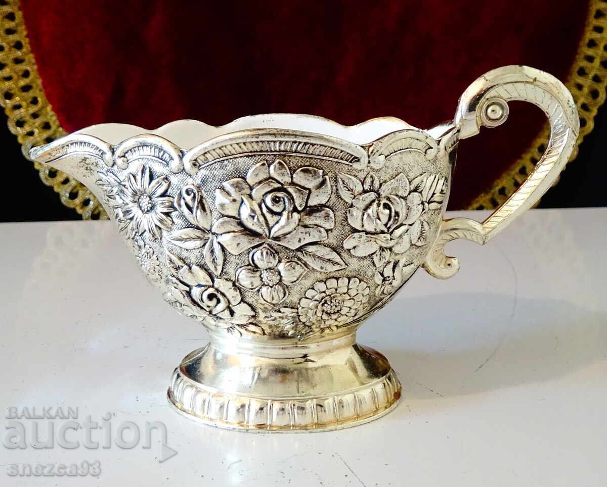 Silver-plated jug, roses, baroque with price 29.00 BGN | € 14.83 Silver-plated jug, roses, baroque with price 29.00 BGN | € 14.83