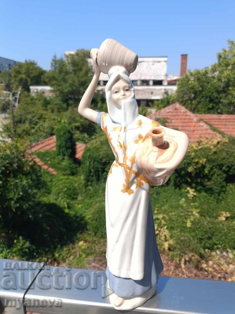 Delivery of Porcelain figure, woman with a jug