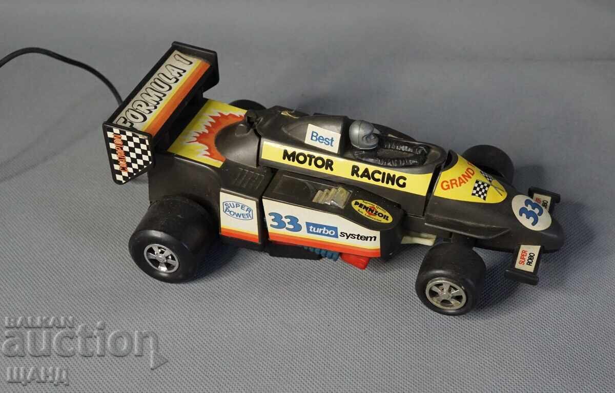 Auction  Old Plastic Toy Transforming Robot from Formula