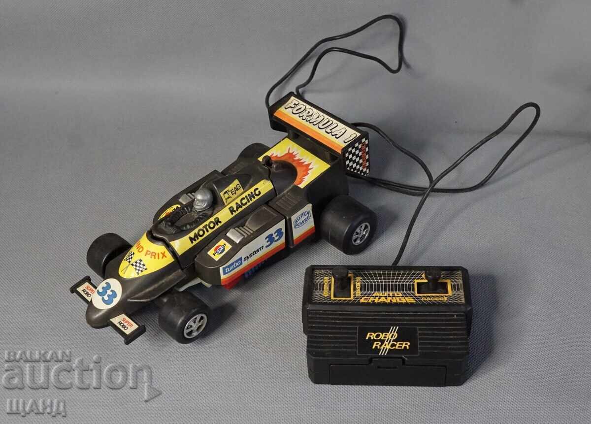 Old Plastic Toy Transforming Robot from Formula