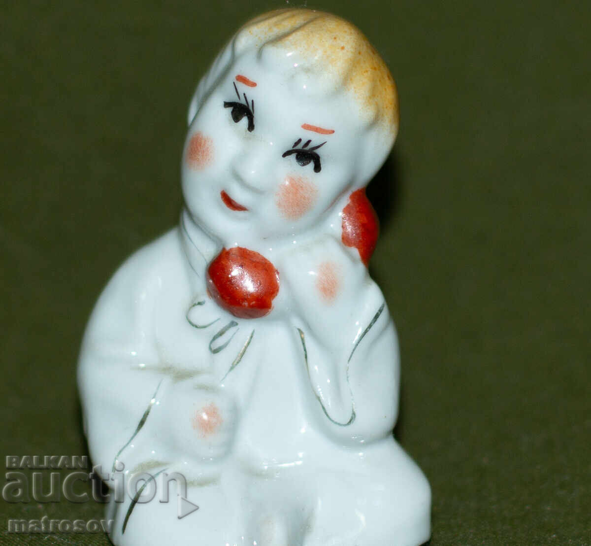 Auction  Old decorative porcelain figurine of a child with a telephone