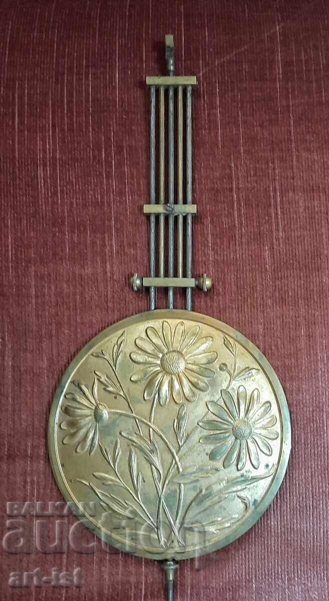 Original antique pendulum from a wall clock Original antique pendulum from a wall clock