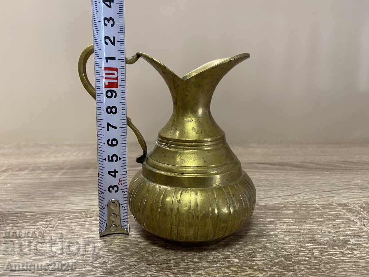 Auction Antique hand-crafted brass jug Auction Antique hand-crafted brass jug