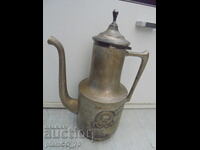 №8223 Old metal jug with a lid and embossed decoration
