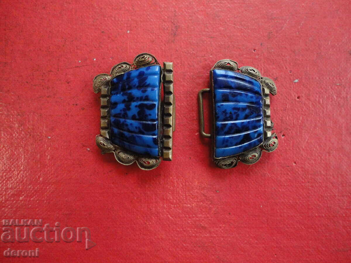 Auction  Gilded belt buckle with stones