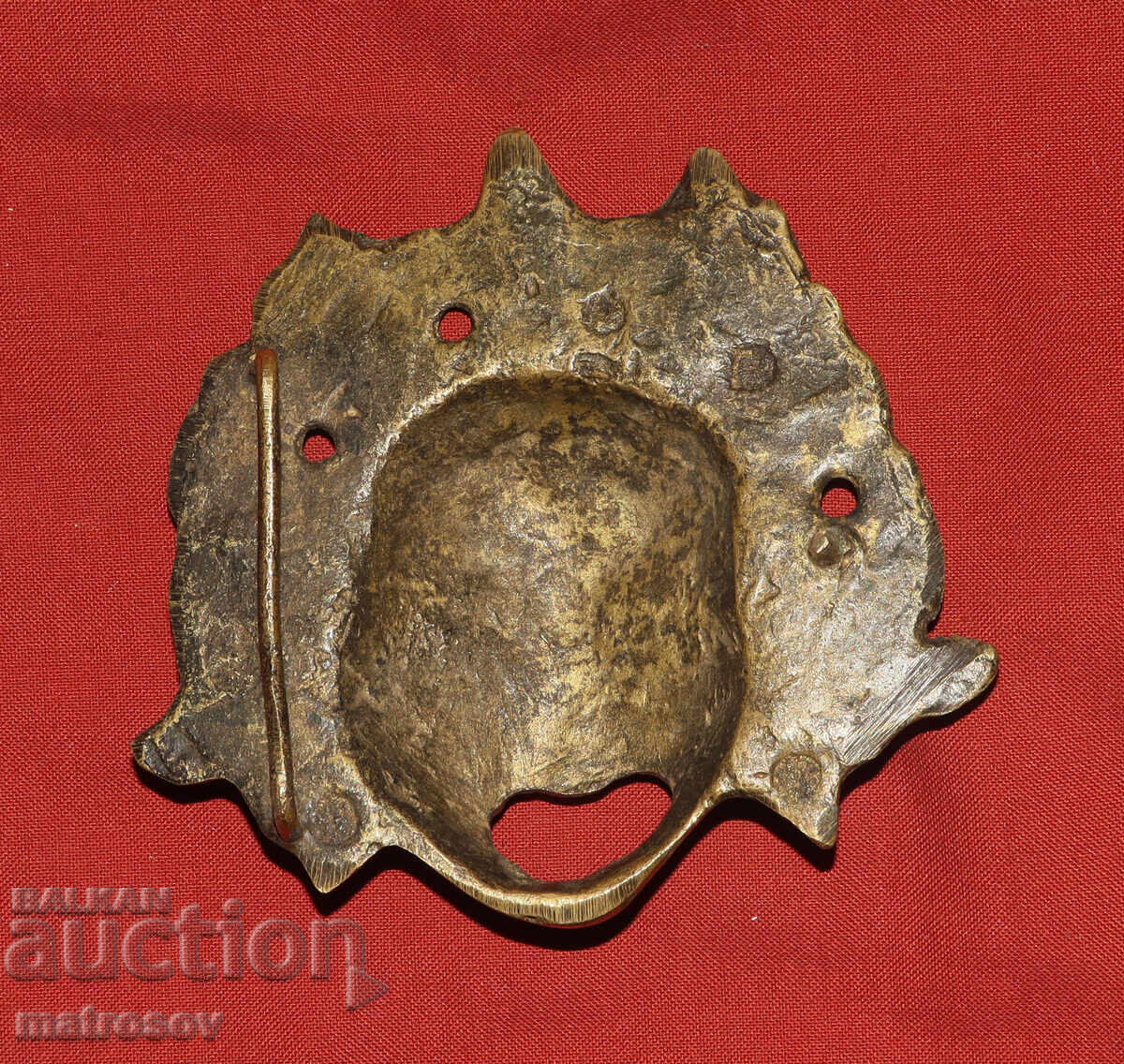 Παράδοση Χάλκινο ανάγλυφο γλυπτό, μάσκα