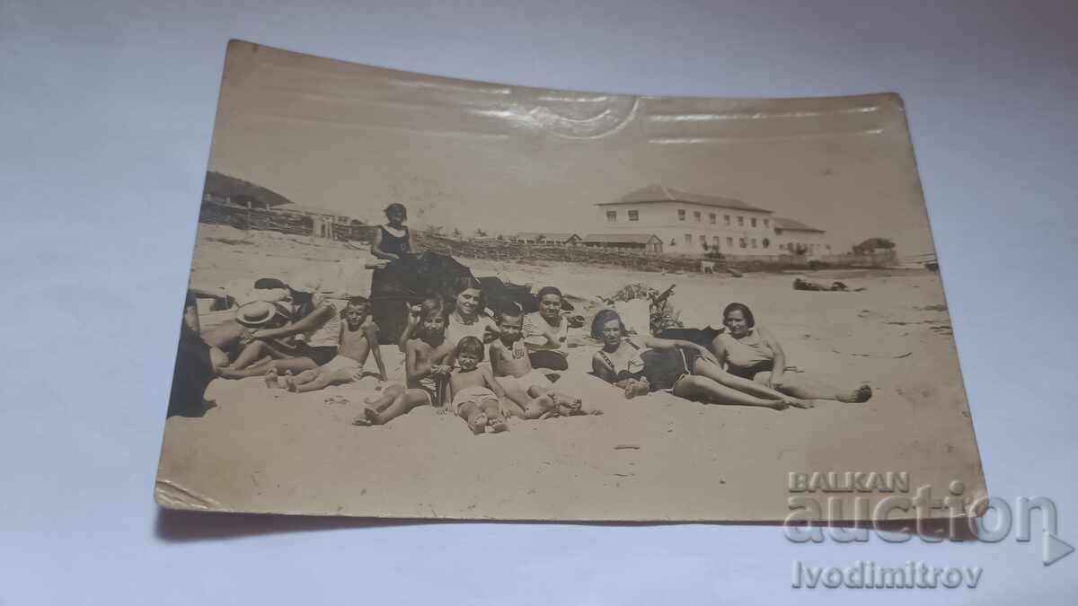 Photo of Man, Woman, Girls and Boys on the Beach
