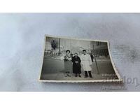 Photo Sofia Man and two women in front of TSUM