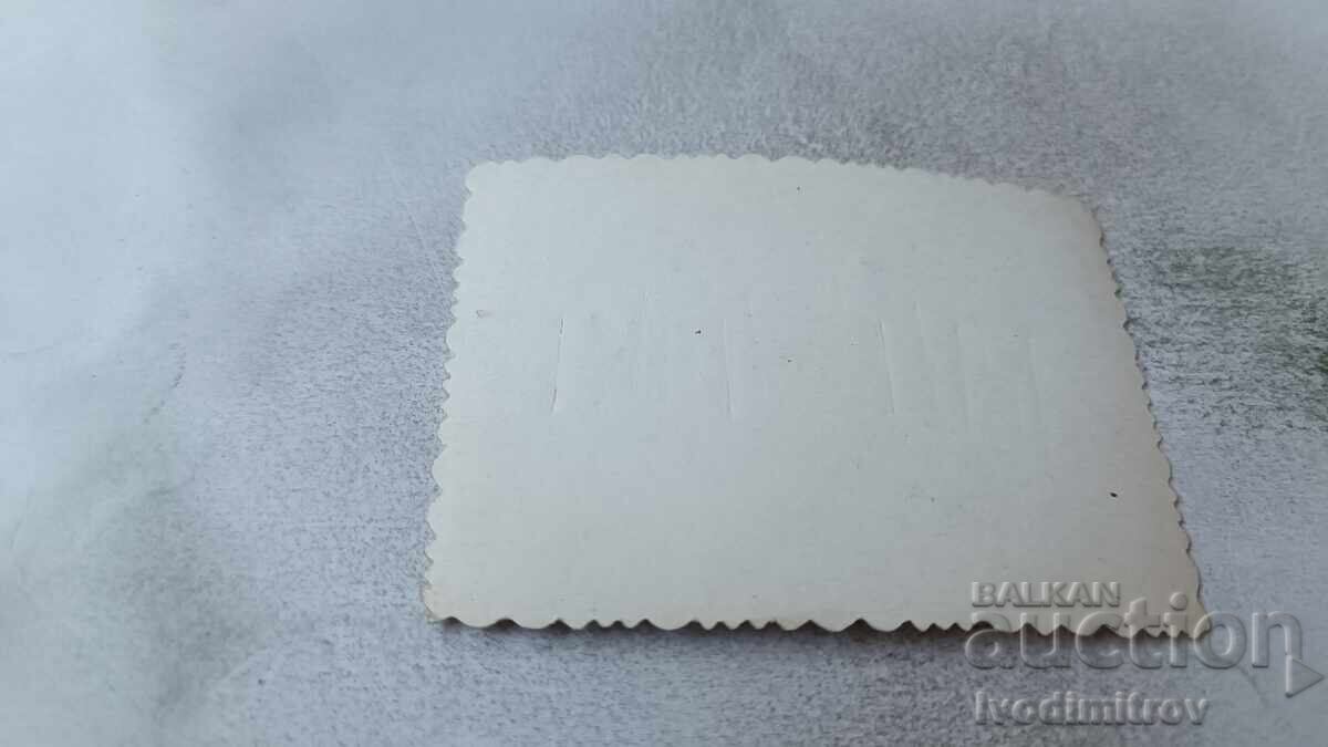 Photo of a young girl sitting in a boat on the beach with price 1.65 BGN | € 0.84