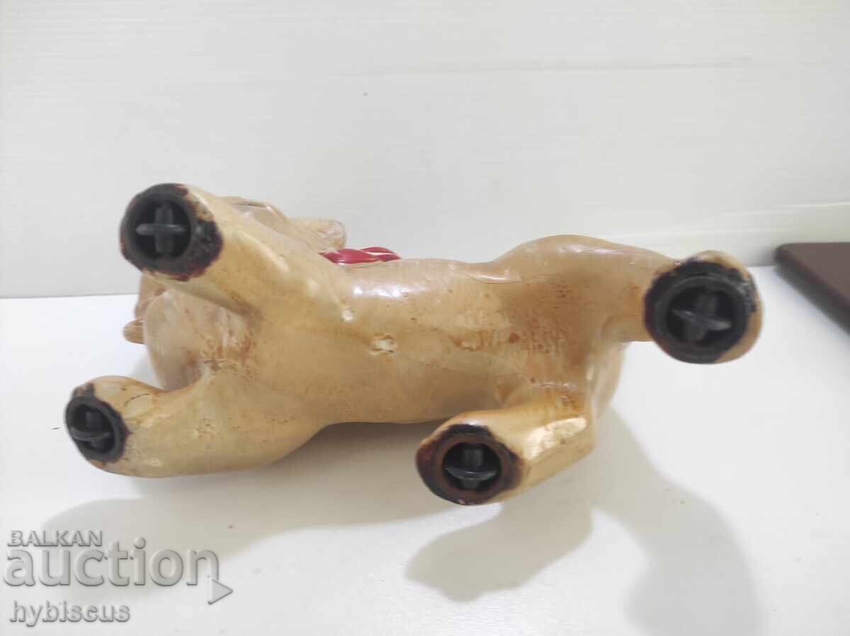 Delivery of Old toy cat on wheels