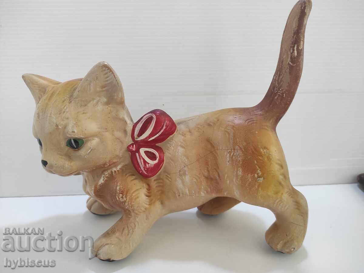 Old toy cat on wheels