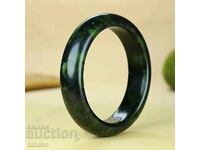 Women's bangle made of dark green jade