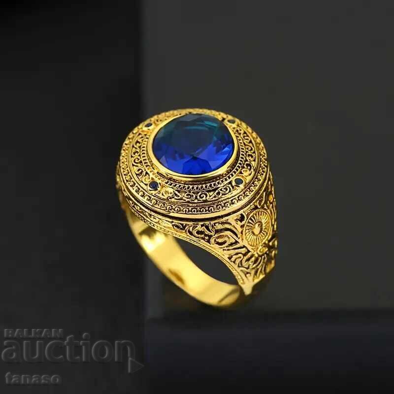 Auction  Gold-colored ring with sapphire