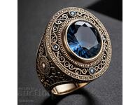 Пръстен в златен цвят, със сапфир