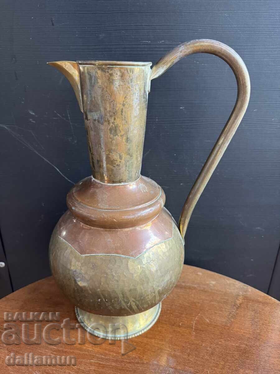 Antique brass pitcher with copper detail