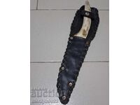 Hunting knife in a sheath with an antler handle