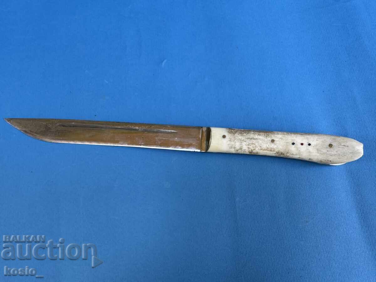 Old knife with a bone handle