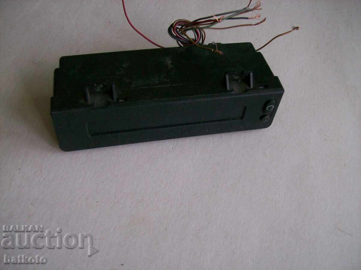 Some kind of car accessory - maybe a clock