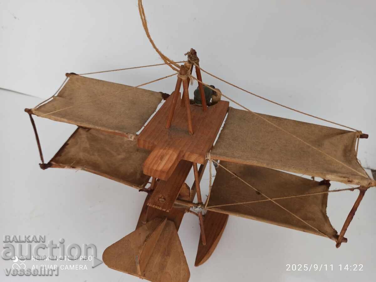 Auction  Very old toy airplane with pilot, flying apparatus, wood