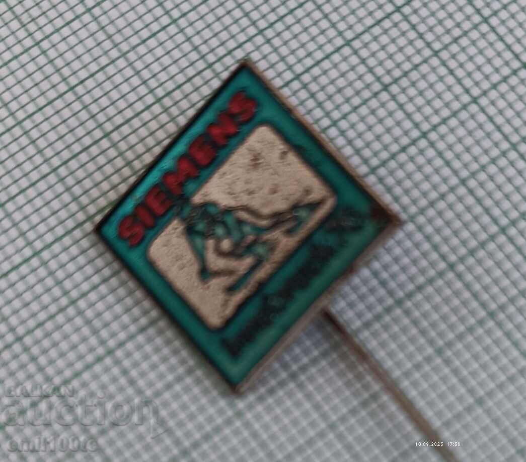 Auction Badge - Winter Olympics Innsbruck 1976 advertisement on SIEMENS Auction Badge - Winter Olympics Innsbruck 1976 advertisement on SIEMENS