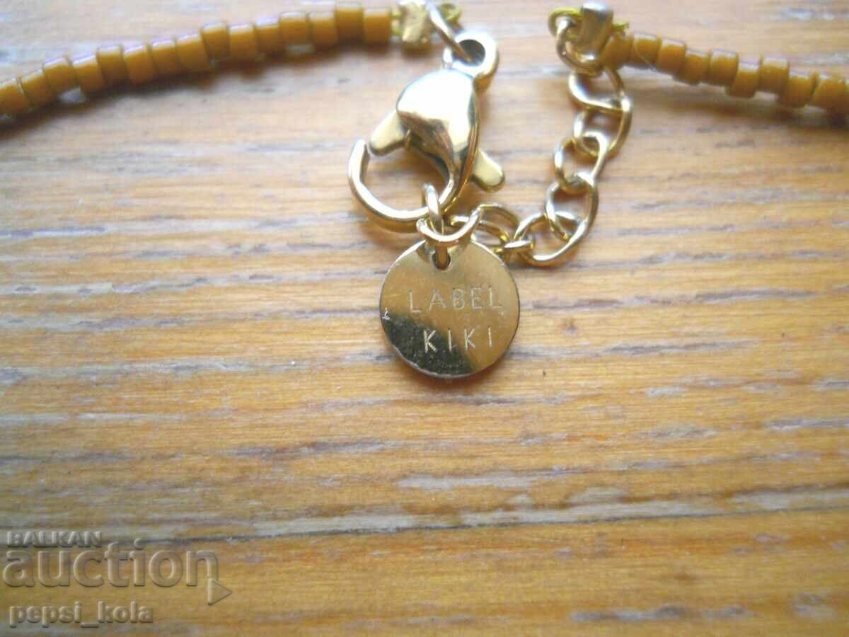 Auction Beaded Necklace with Gold-Plated Pendants "Label Kiki" Auction Beaded Necklace with Gold-Plated Pendants "Label Kiki"