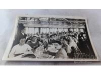 Passengers in the dining room of the steamboat on the way to Budapest