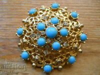Old brooch with turquoise