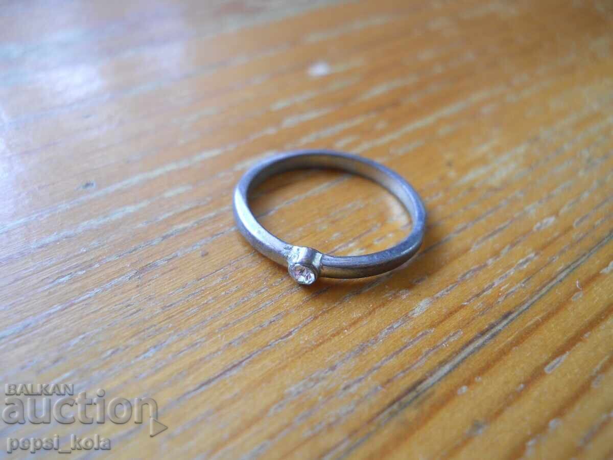 Old metal women's ring with a stone