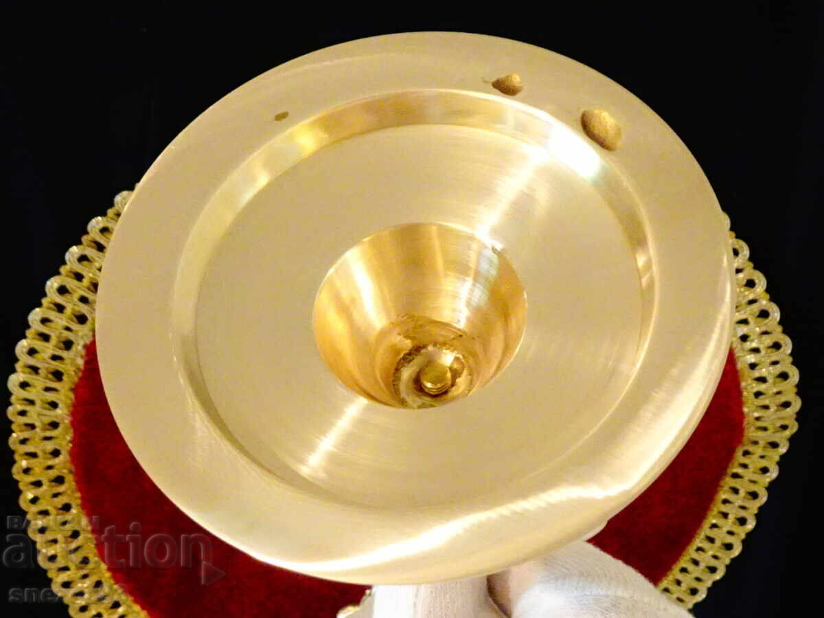 Auction  Bronze candlestick with Baroque decoration, 32 cm tall