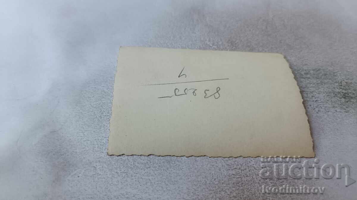 Auction  Photo Sofia Young woman in front of a Wine and Rakia shop