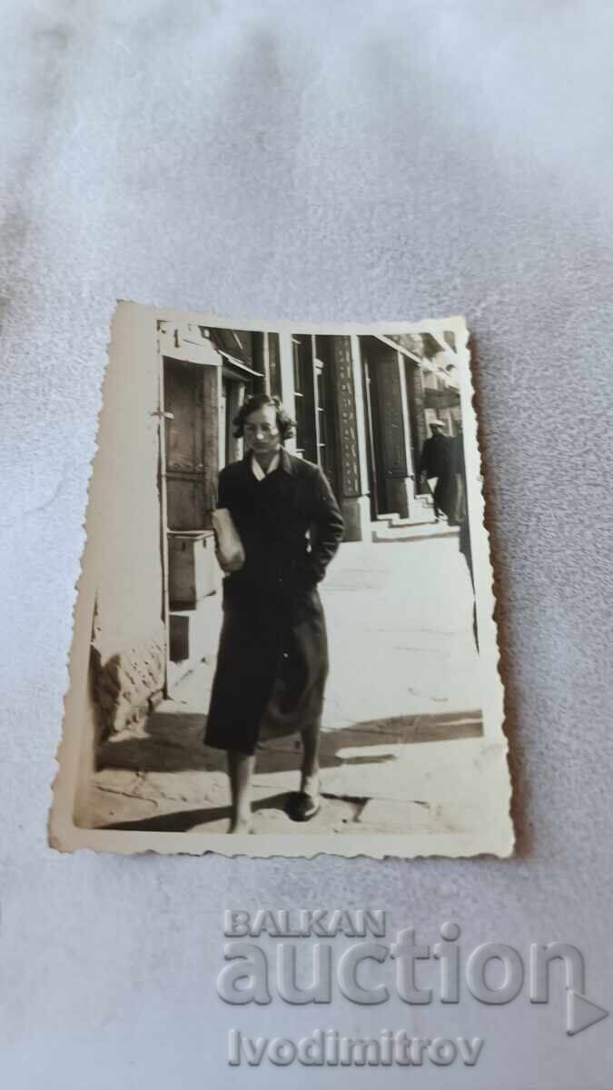 Photo Sofia Young woman in front of a Wine and Rakia shop