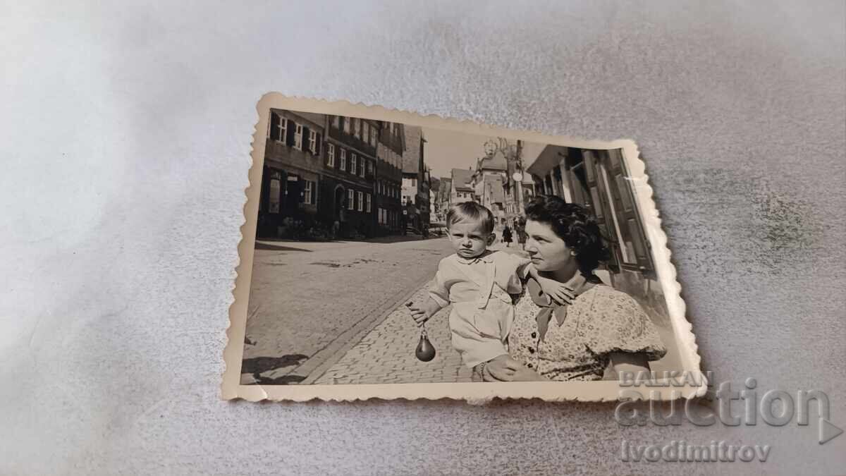 Photo of a Woman and a Little Boy on the Sidewalk Photo of a Woman and a Little Boy on the Sidewalk