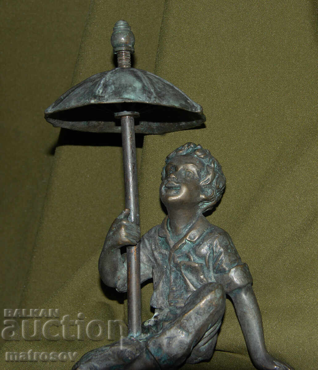 Auction  Old bronze sculpture of a boy with an umbrella