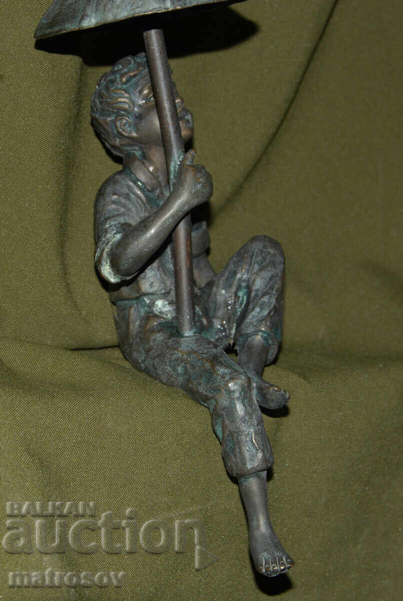 Old bronze sculpture of a boy with an umbrella - 5