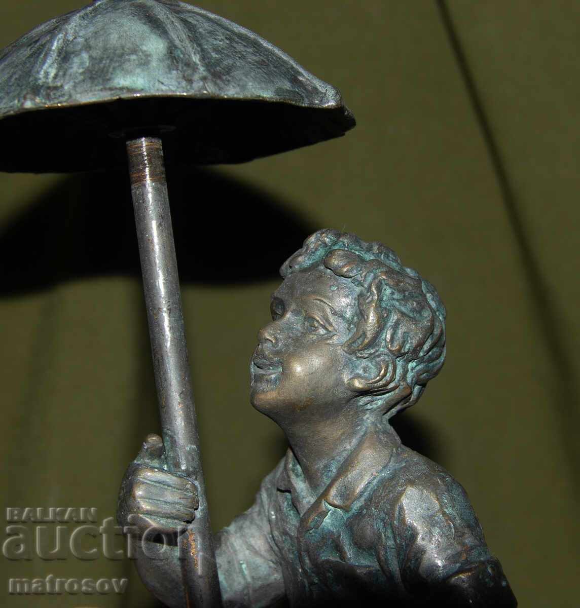 Old bronze sculpture of a boy with an umbrella - 7