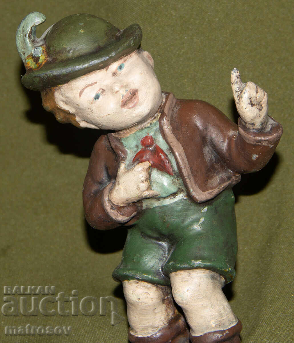 Auction  Original metal sculpture of a boy in Bavarian costume