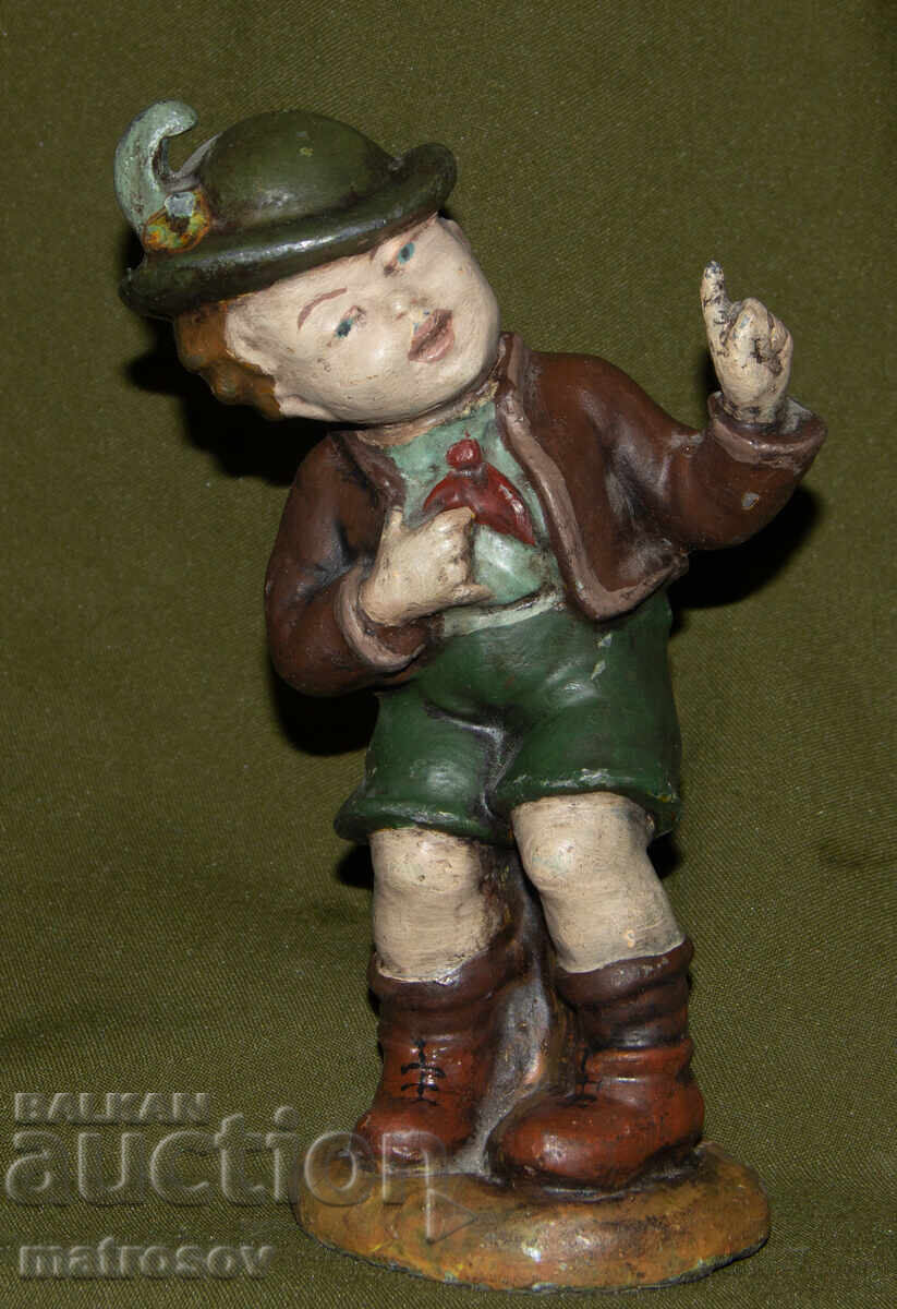 Original metal sculpture of a boy in Bavarian costume