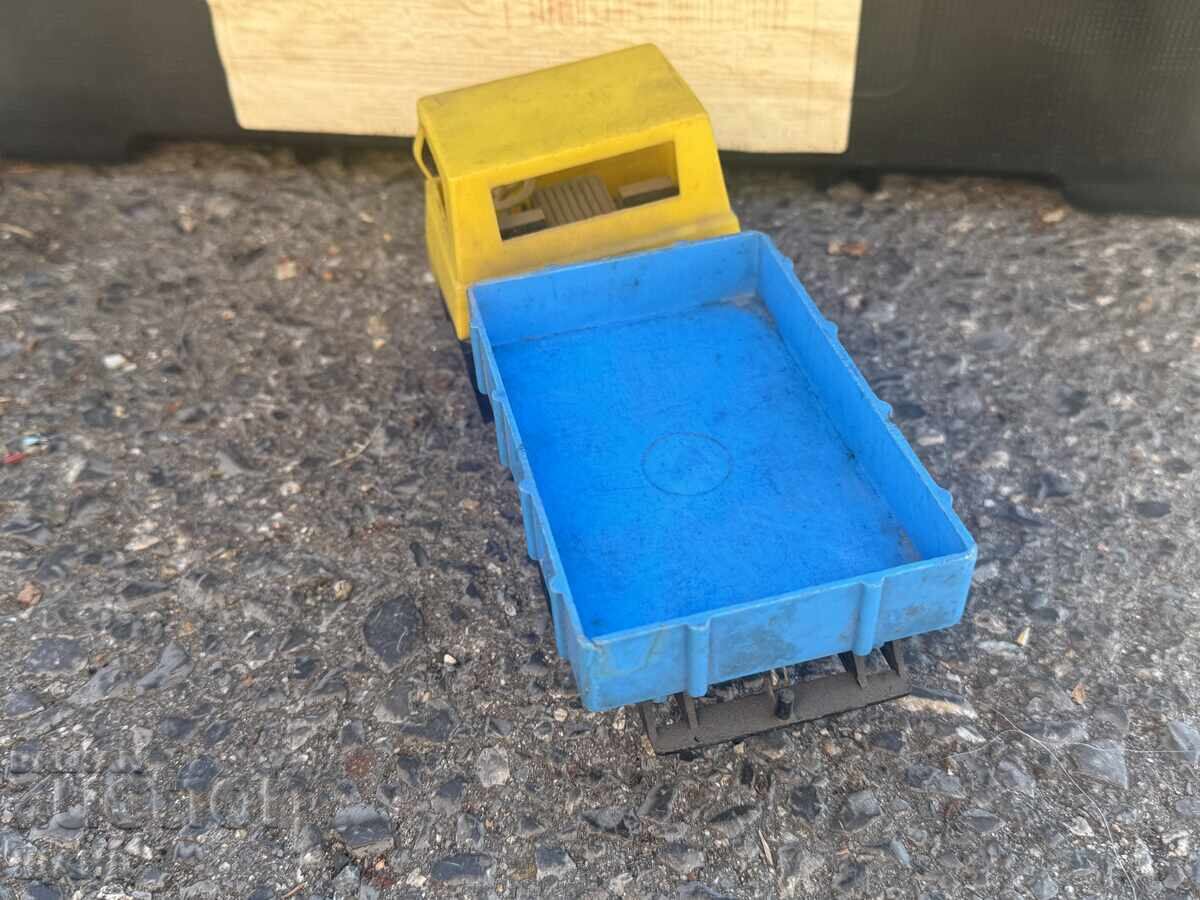 Delivery of Old plastic toy truck model