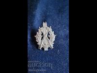 Σήμα, κονκάρδα, μετάλλιο σκοποβολής