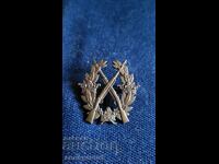 Σήμα, κονκάρδα, μετάλλιο σκοποβολής