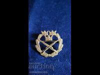 Σήμα, κονκάρδα, μετάλλιο σκοποβολής