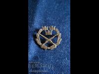 Σήμα, κονκάρδα, μετάλλιο σκοποβολής