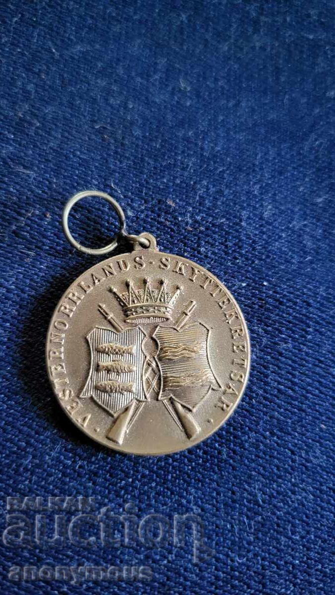 Σήμα, κονκάρδα, μετάλλιο σκοποβολής Σήμα, κονκάρδα, μετάλλιο σκοποβολής