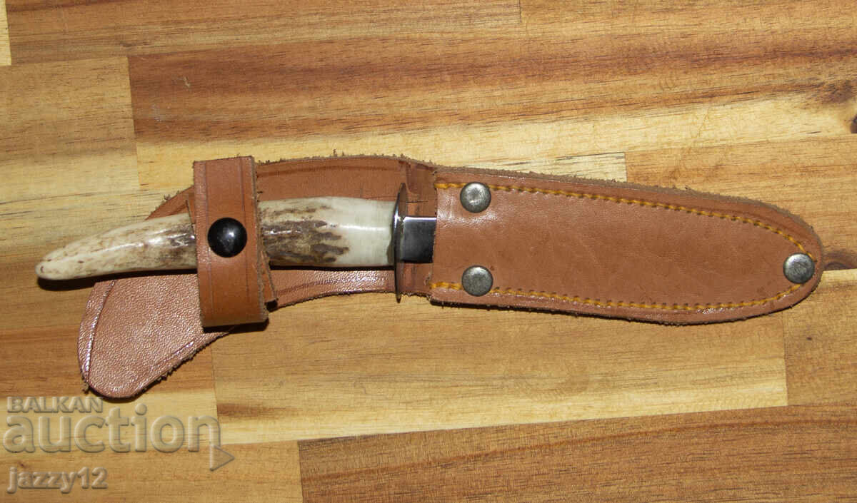 Auction  Hunting knife with a horn handle
