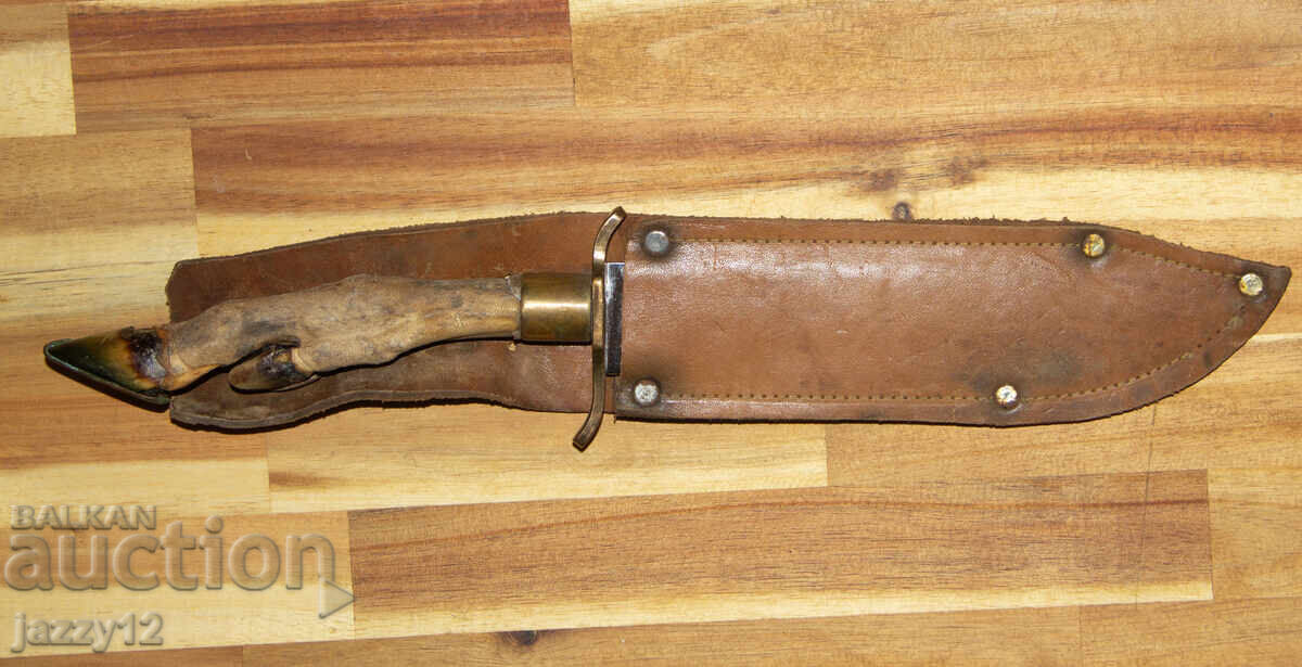 Solid hunting knife with a hoof handle