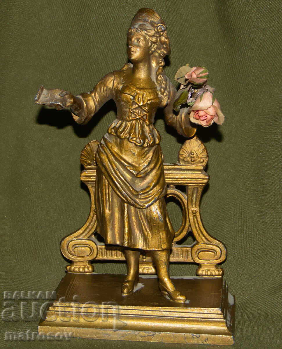 Old metal decorative statue sculpture woman with flowers Old metal decorative statue sculpture woman with flowers