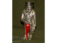 Mica figurină argintată, bărbat cu joben